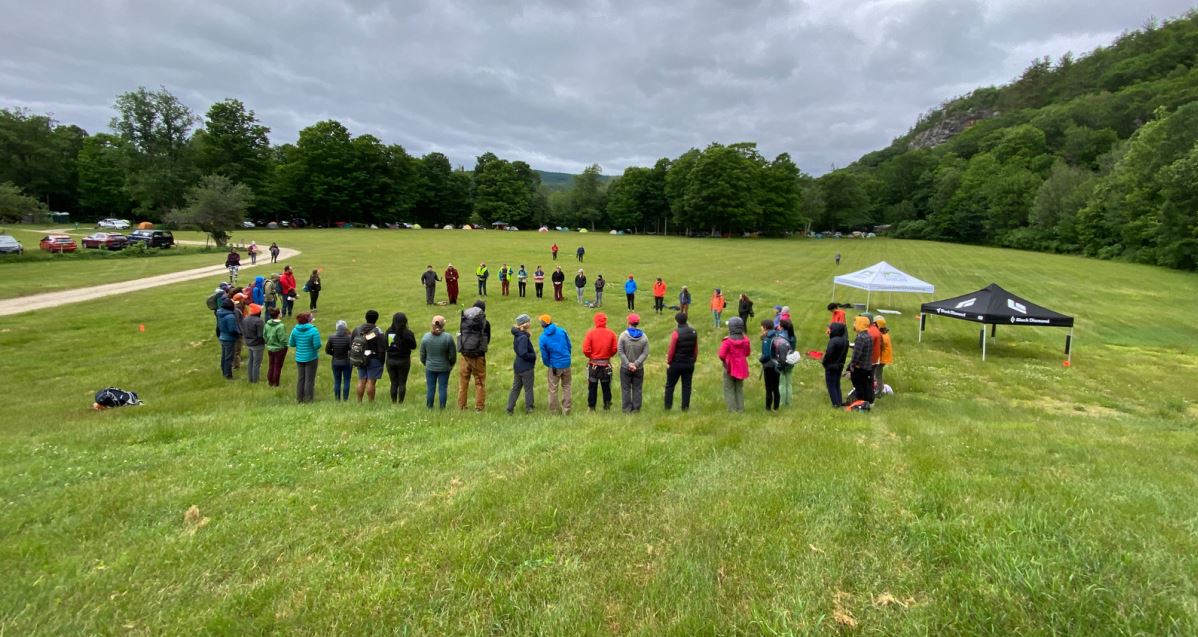 Participants gathering in a circle during the blessing ceremony and land acknowledgment.