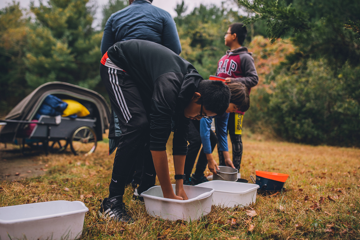 cleaning dishes at camp