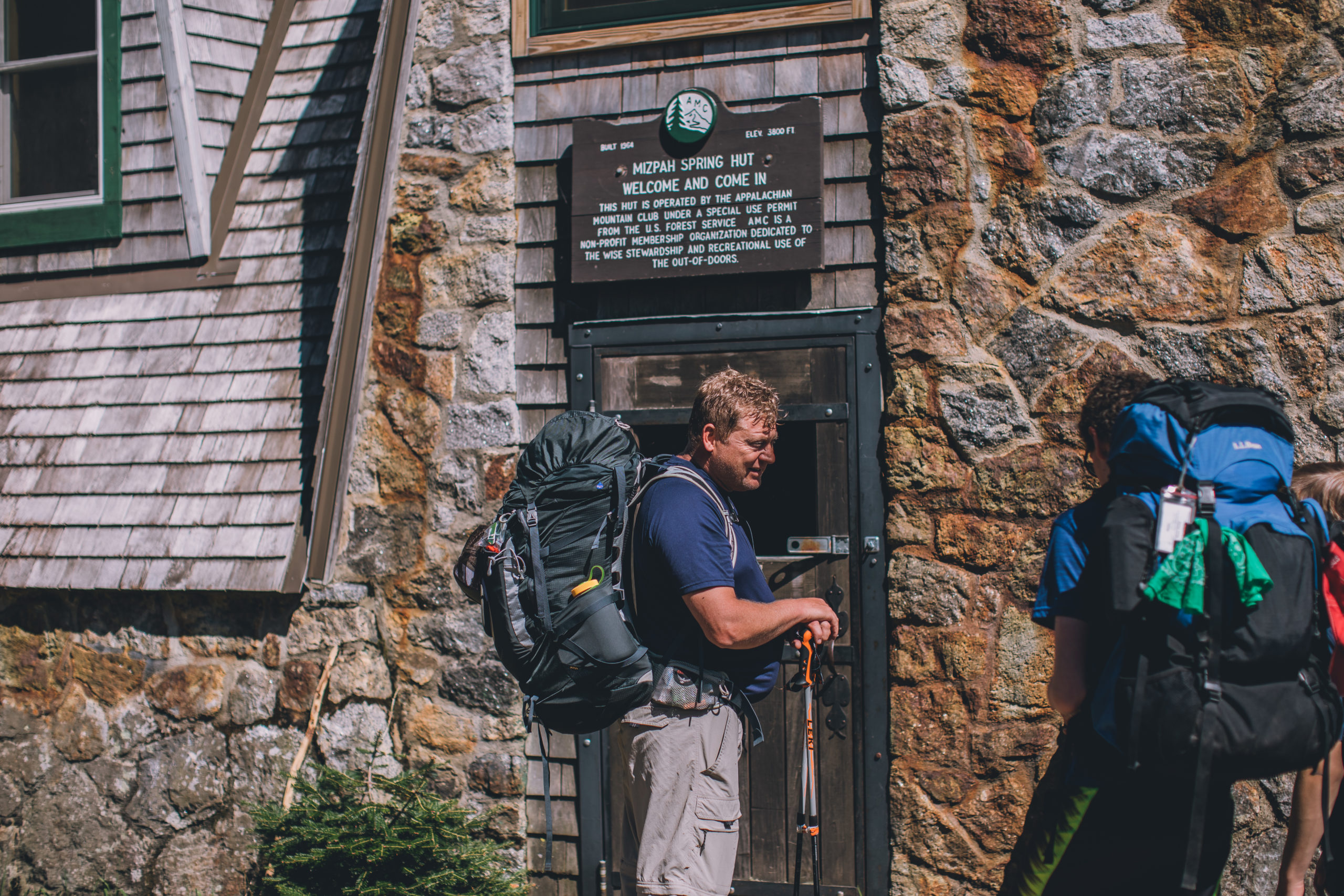 Hikers outside Mizpah Spring Hut