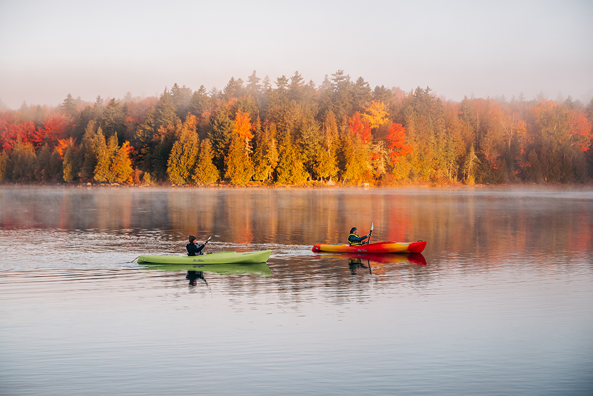 kayaker padding near Gorman Lodge in Maine Woods