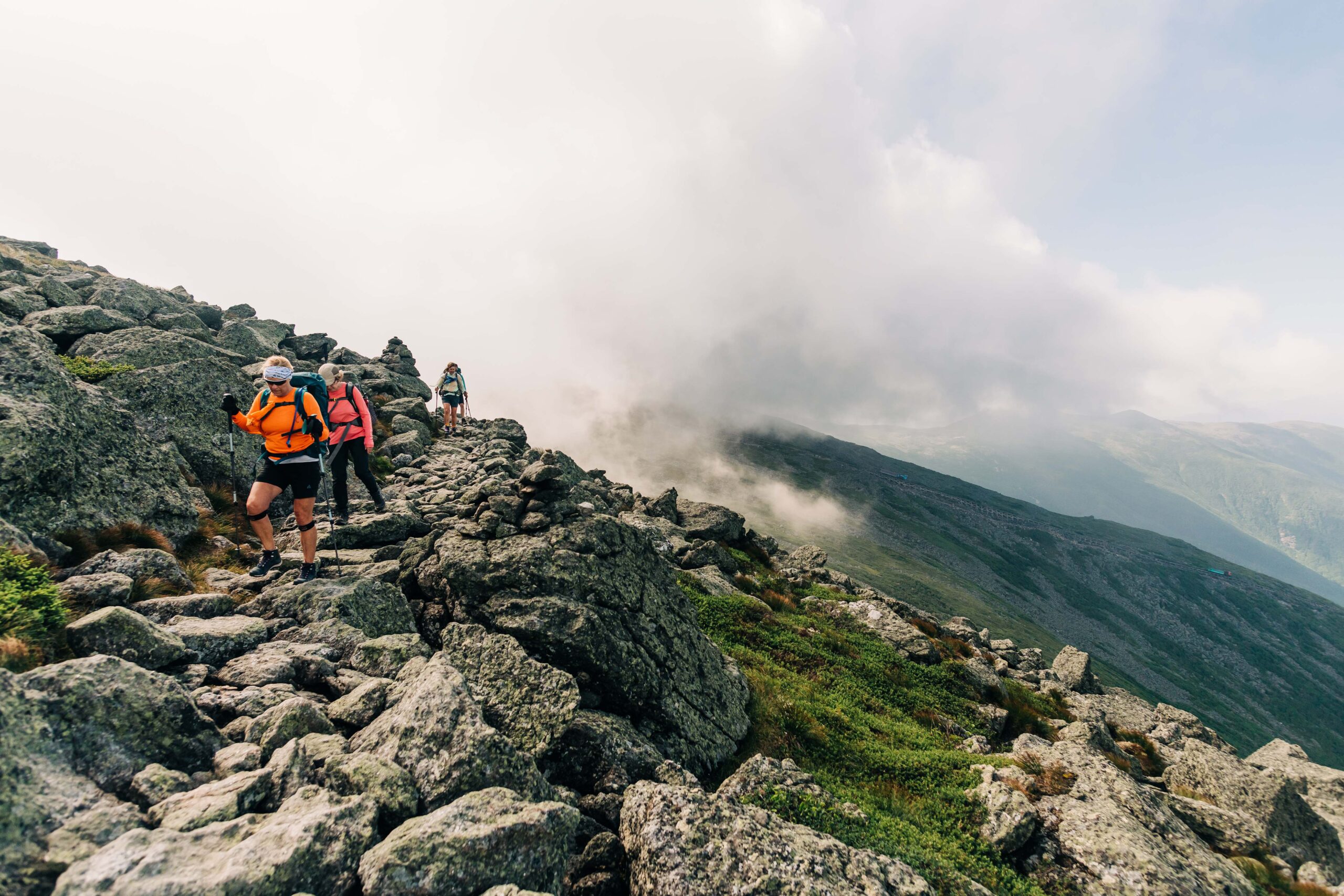 hikers traversing rocky terrain