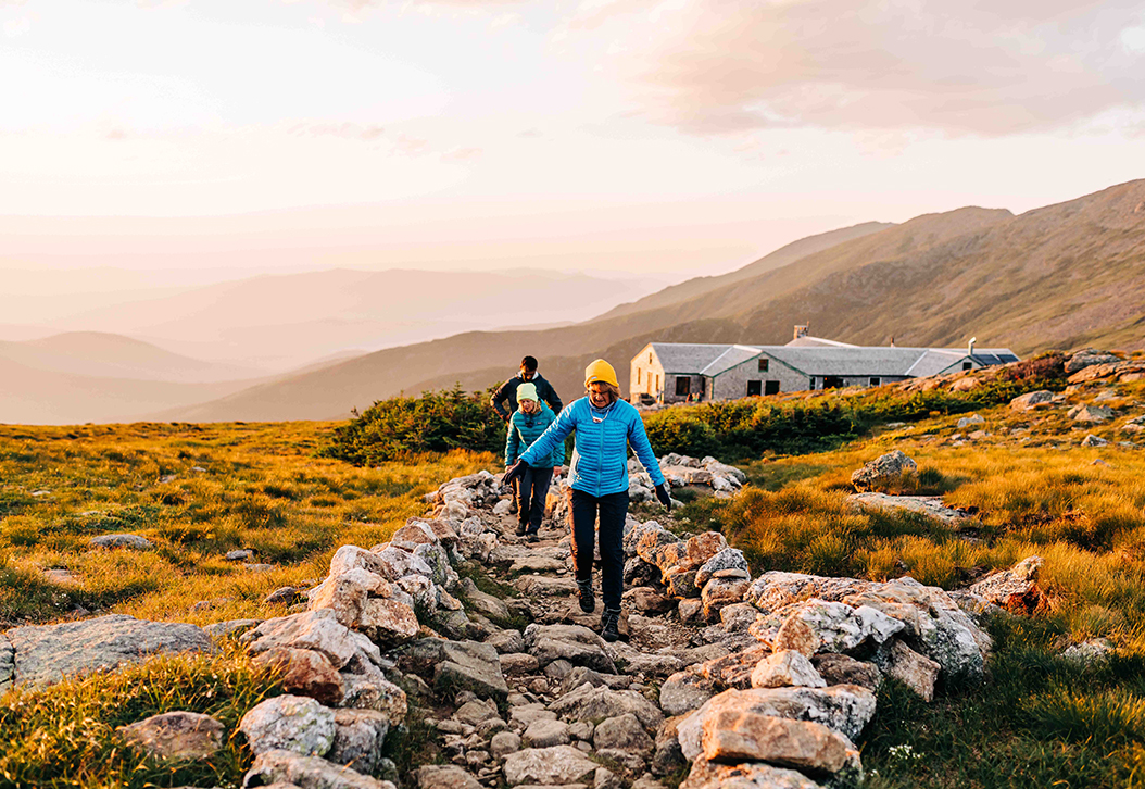 hikers on path outside Lakes of the Clouds hut