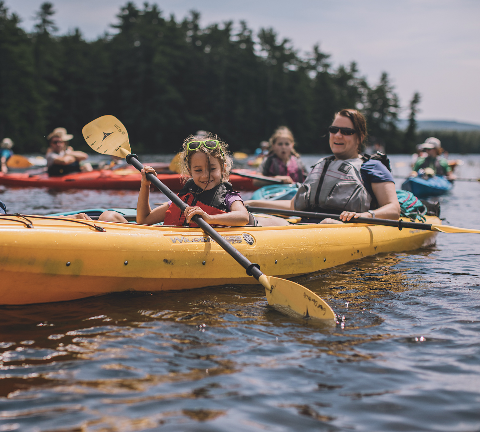 Family kayaking on Conway Lake